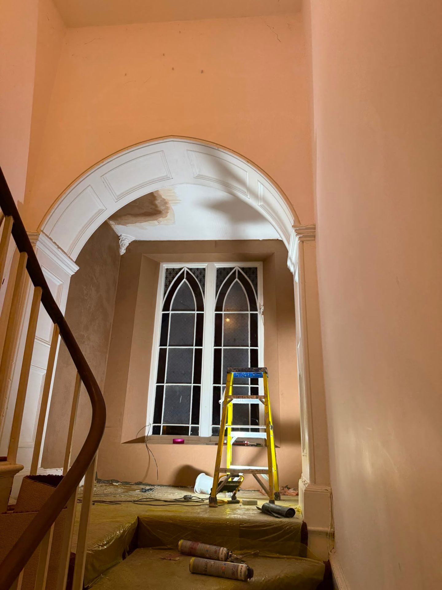 Finished interior hallway with ornamental archway and fresh plaster on a whole-house refurbishment by LEWZ