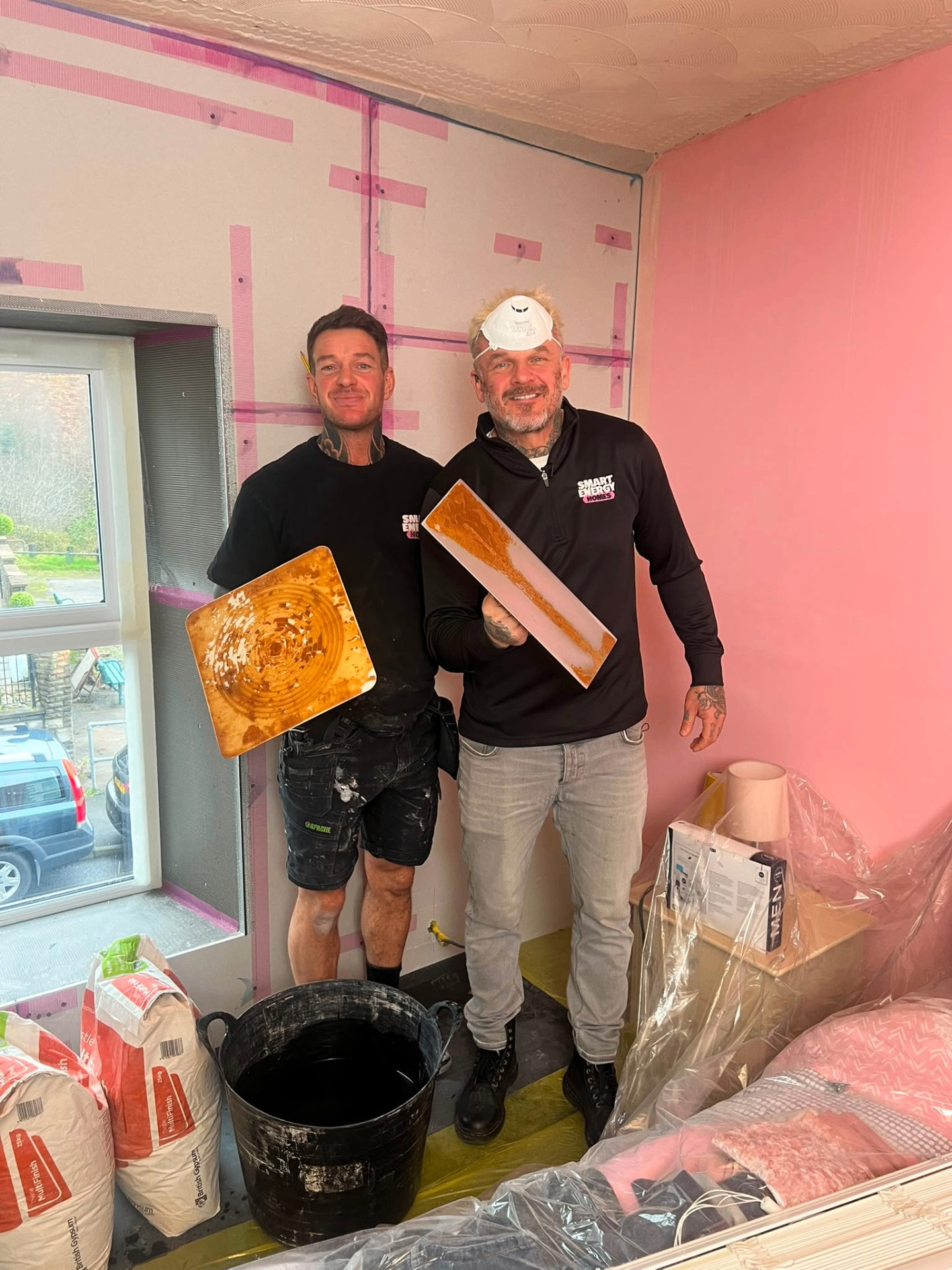 Two LEWZ Property Development plasterers on site mid-job during a residential refurbishment in South Wales